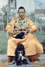 Buddhist Lama with his spaniels